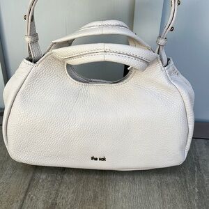 The Sak Rylan small handbag.  Neutral stone/off white color
